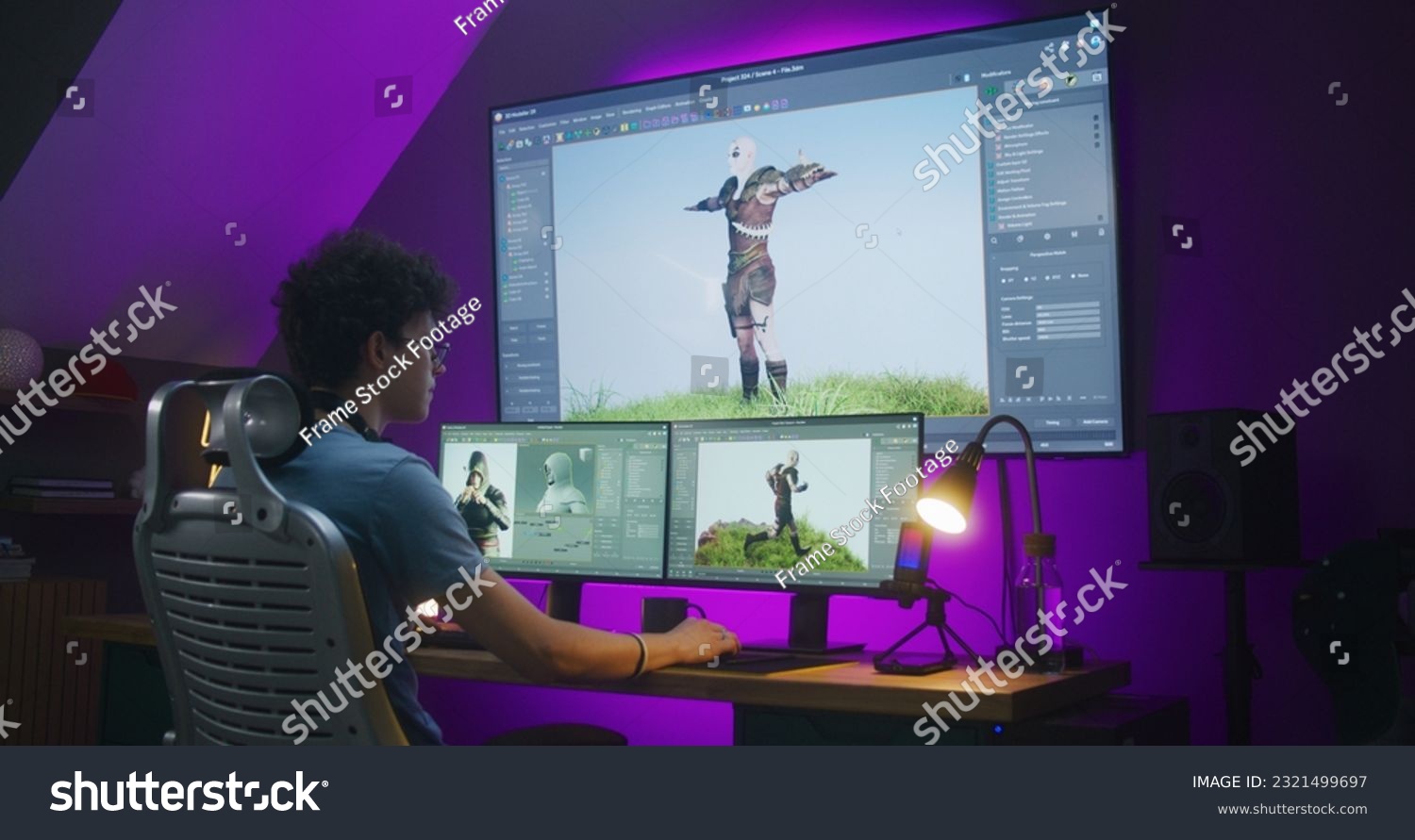 stock-photo-young-creative-d-designer-creates-video-game-character-or-animation-works-remotely-at-home-office-2321499697