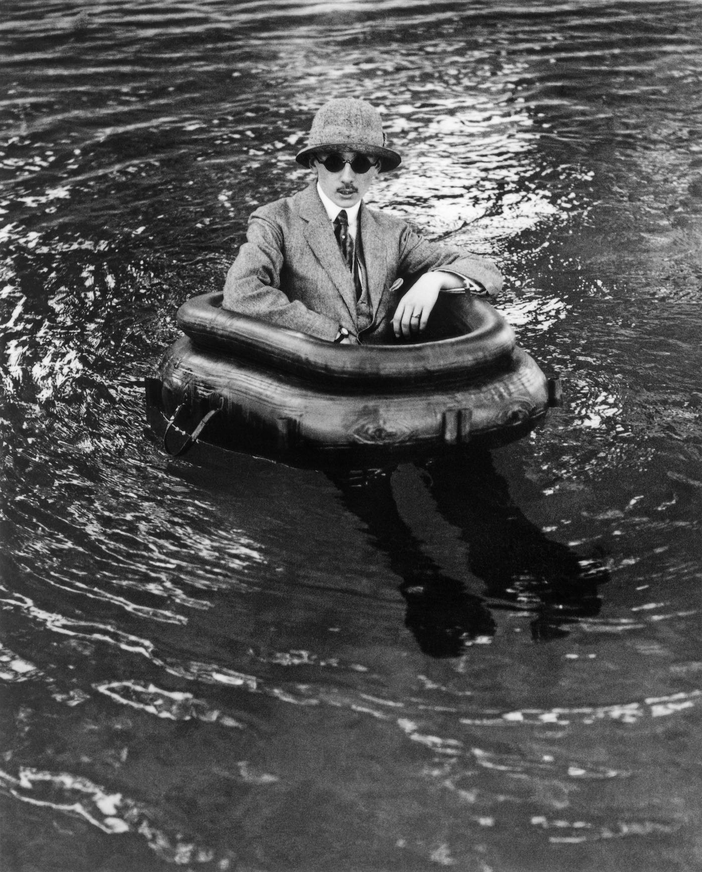 Henri lartigue  zissou in his tire boat by jacques  1911