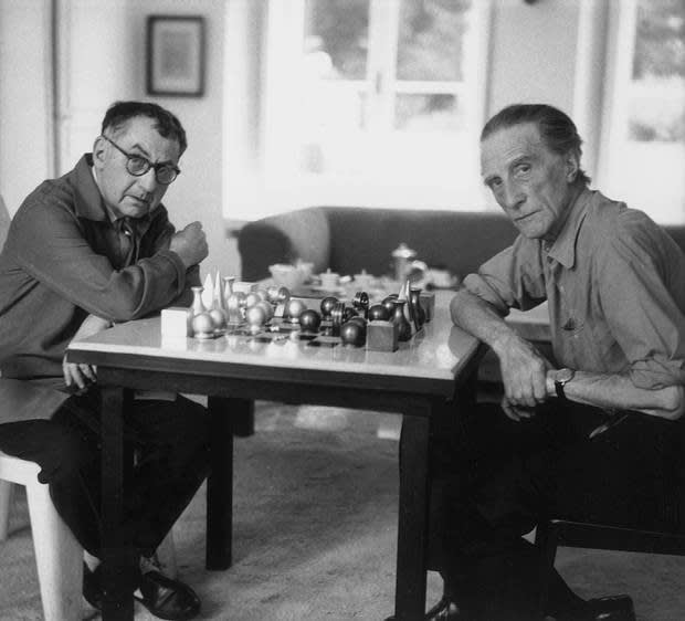  Man Ray and Marcel Duchamp , Playing chess with Man Ray's chess set 