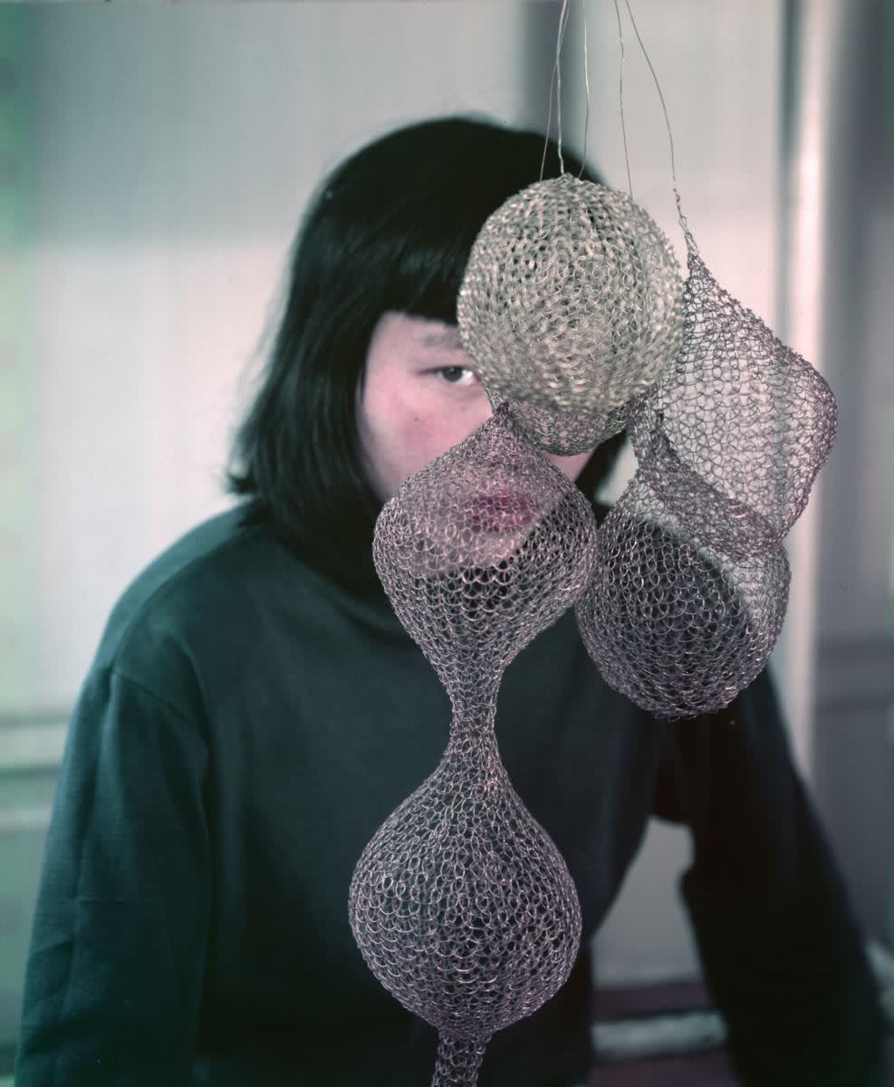 A photograph of ruth asawa and her art taken by her close friend imogen cunningham circa 1957