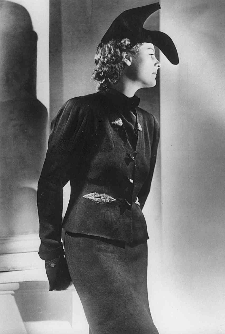 Elsa schiaparelli salvador dali suit embroidered with lips and  shoe  hat  winter 1937