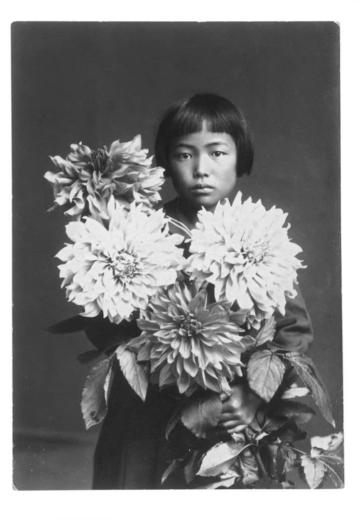 Yayoi kusama with flowers  at the age of ten in 1939
