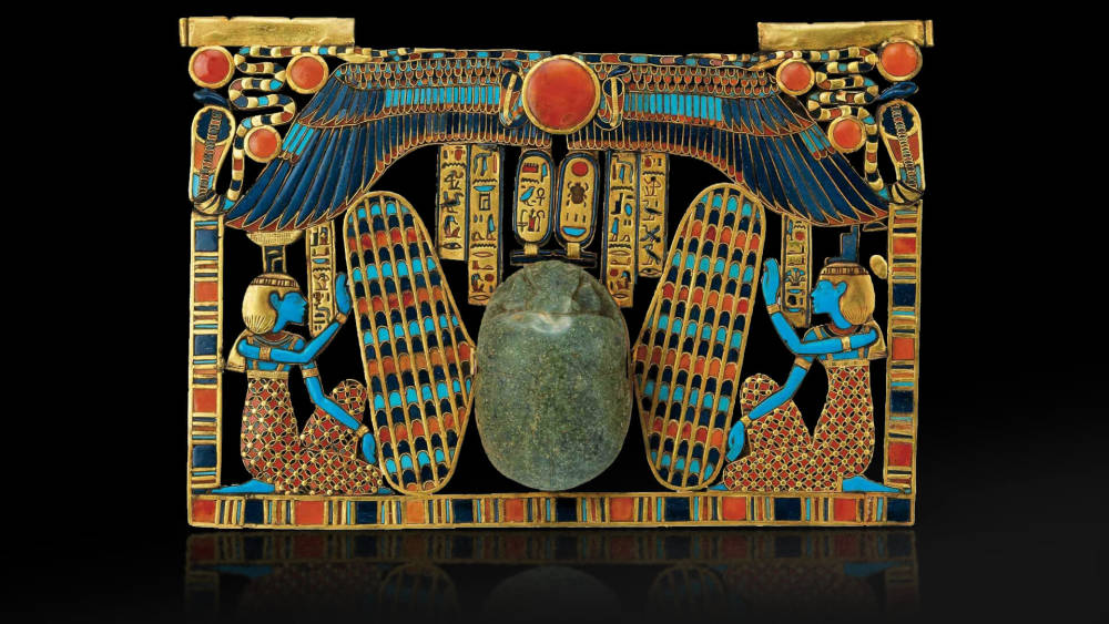Tutankhamun. inlaid pectoral  scarab beetle with isis and nephthys