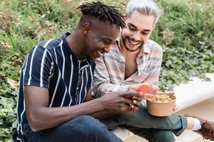 Friends sharing food outdoors