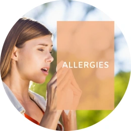 Caption reads: Allergies. In the background, a woman is about to sneeze into a tissue.