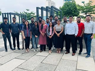 Meghna Sah and extended team picture outside in the city