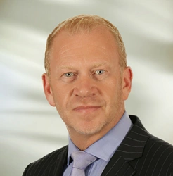 Headshot of Tim Bliss, AXA