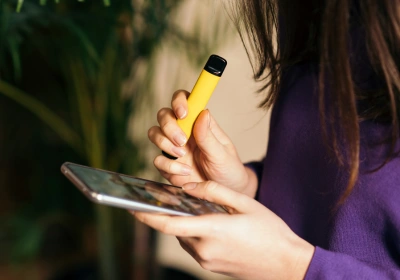 Woman holding vape