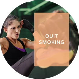 Caption reads: Quit smoking. In the background, a woman kick-boxes a punching bag.