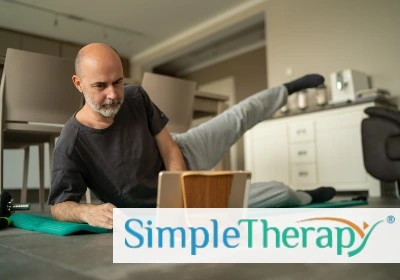 Man does hip exercises on the floor on a mat. Image features SimpleTherapy logo.