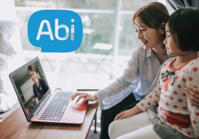 Woman and child looking at laptop screen 