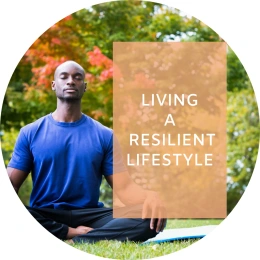 Caption reads: Living a resilient life. In the background, a man closes his eyes as he sits in a yoga pose in a serene outdoor setting.