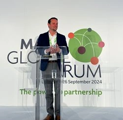 Paul Lewis speaking at the MAXIS global forum