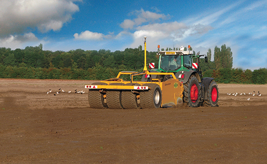 A farmer uses Trimble's FieldLevel II system for land forming activities.