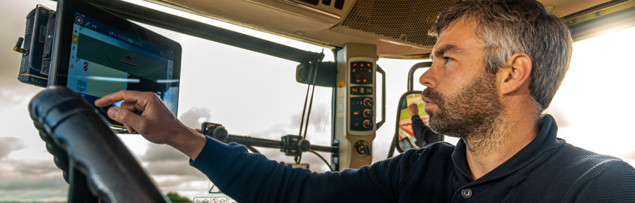 A farmer in France configures his PTx Trimble GFX display for planting.