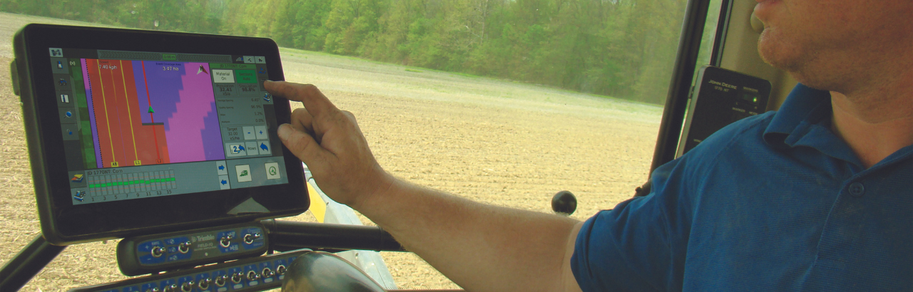 A farmer uses Trimble's TMX-2050 display system with Field-IQ.