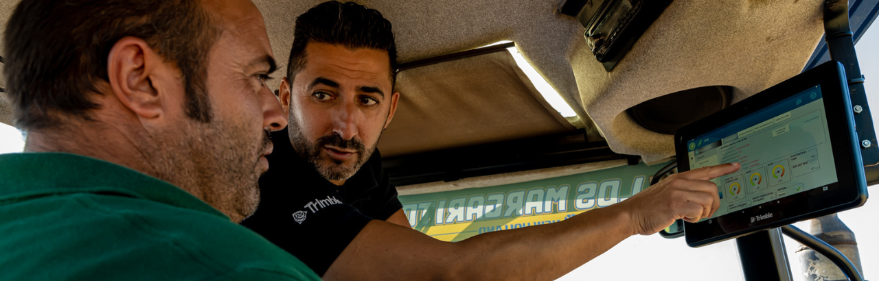 A Trimble reseller supports a farmer when setting up their new Trimble display.