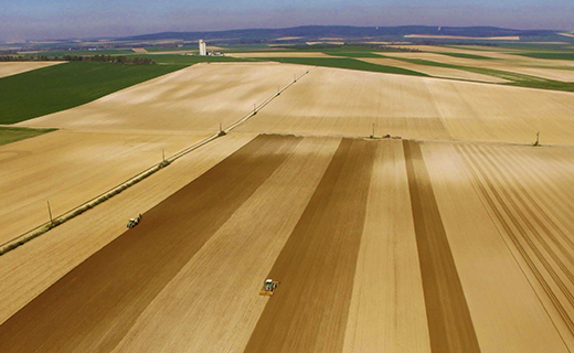 An aerial photograph of a farmer using Trimble's EZ-Steer system to add precision to their operations.