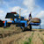 A farmer lays drainage tile using Trimble's water management solutions.
