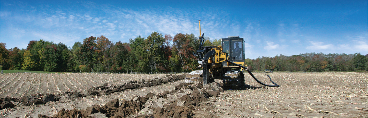 A farmer or earthworks contractor installs drainage tile and, in the sidebar, text says "3 Level-Headed Strategies for Successful Water Management".