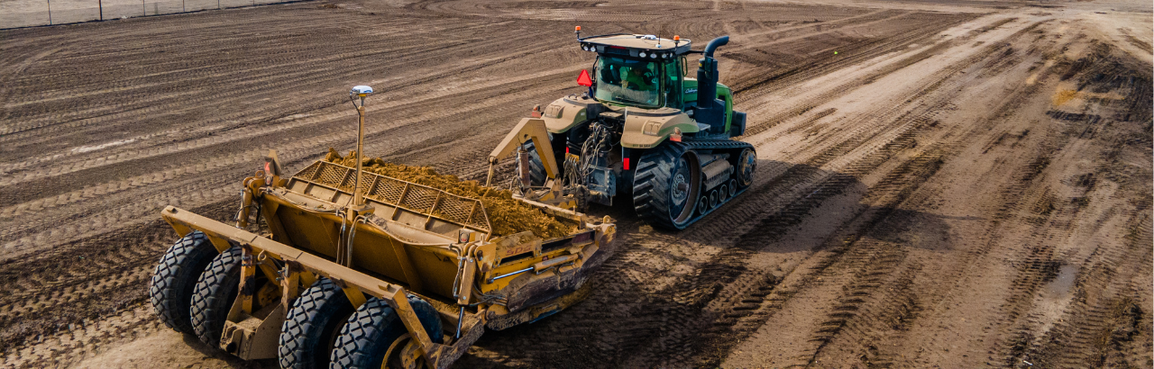 A contractor levels farmland using PTx Trimble Precision-IQ and WM-FieldForm.
