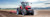 A Massey Ferguson tractor doing field work using PTx Trimble precision technology.