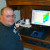 A photograph of Andy Zimmerman in his office using WM-Subsurface design software.