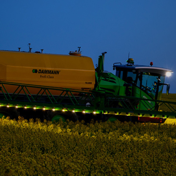 An image of a Dammann sprayer operating at dusk.