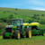 A farmer uses Trimble's TrueGuide implement guidance system to add precision to planting activities on contoured land.