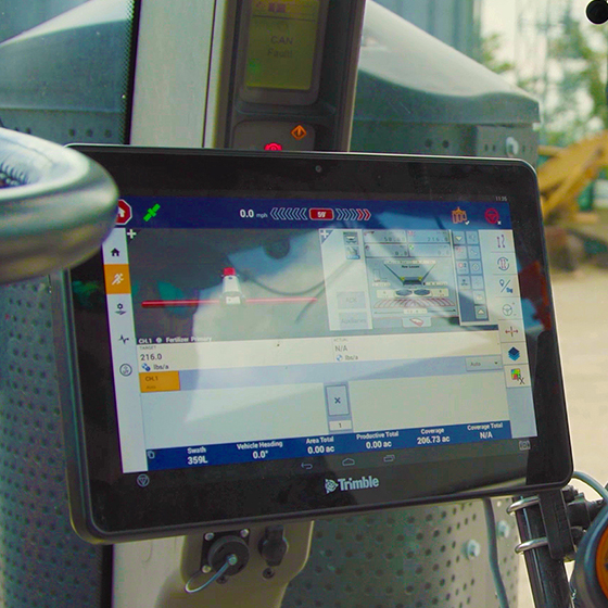 An up-close image of a Trimble display in the cab of a tractor.