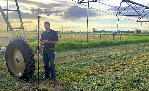 A farmer conducts a survey using the Trimble WM-Survey II app.