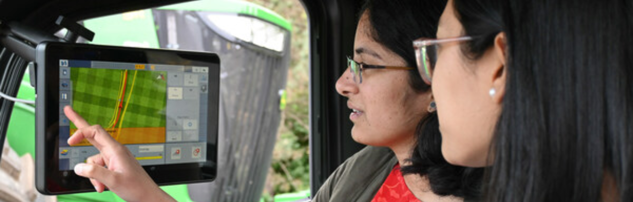 A student and teacher looking at a display system
