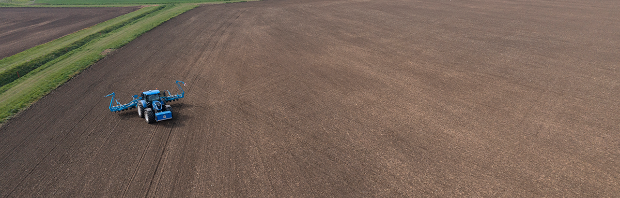 A farmer plants a field