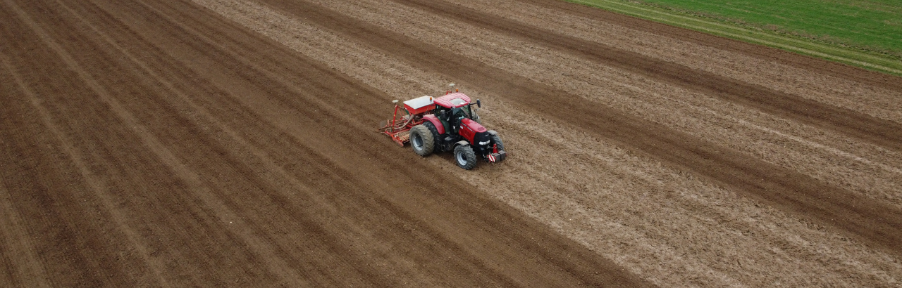 A tractor uses Trimble precision technology to operate in straight lines every year.