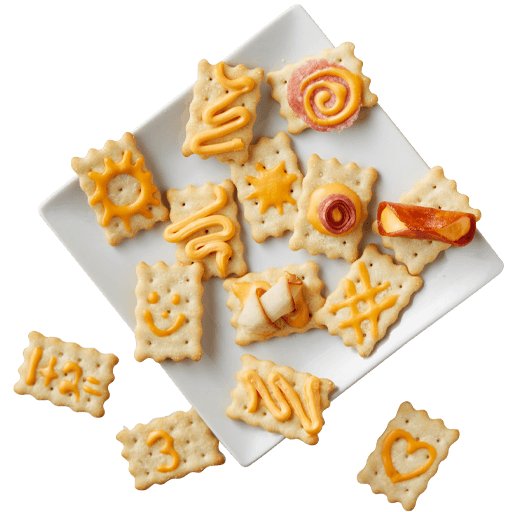 Crackers on a plate with Easy Cheese and other toppings