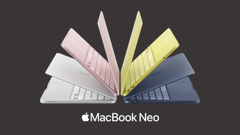 Fyra MacBook Neo-laptops i olika färger: silver, rosa, gul och mörkblå, arrangerade i ett solfjäderformat mönster.