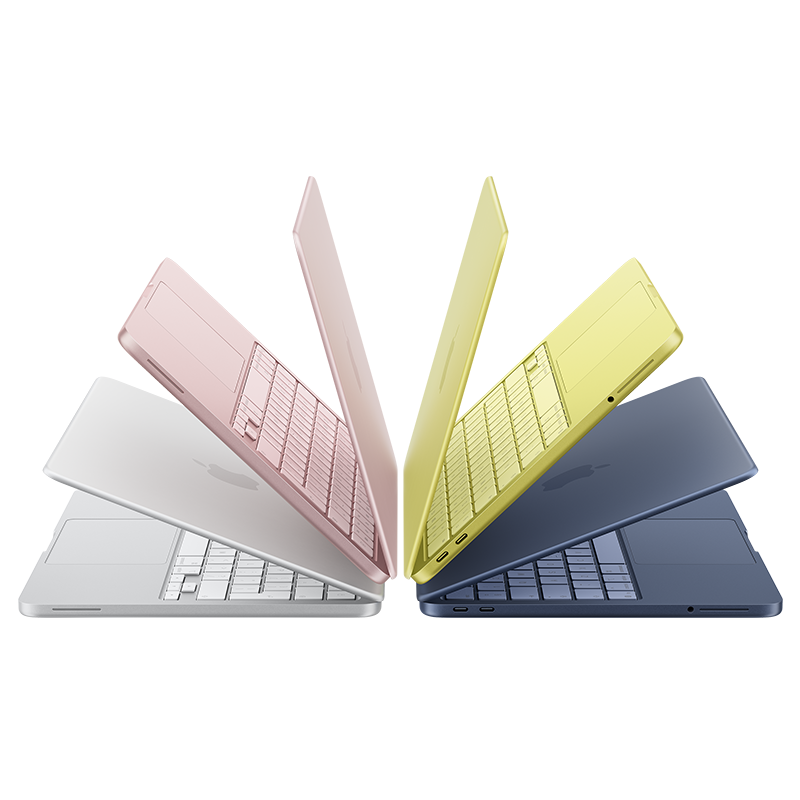 Fyra MacBook Neo-datorer i olika färger: silver, rosa, gul och mörkblå, uppställda i ett solfjäderformat mönster.