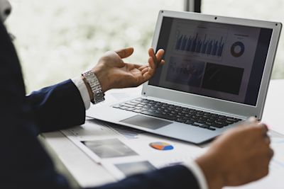 professional reviewing chart statistics and performance