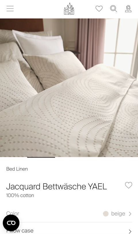 "Schlossberg Switzerland" Mobile homepage showing a white bed in front of a window