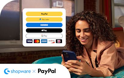 PayPal Integration in Shopware A woman lying on the bed with a smartphone in both of her hands, browsing the different payment options.