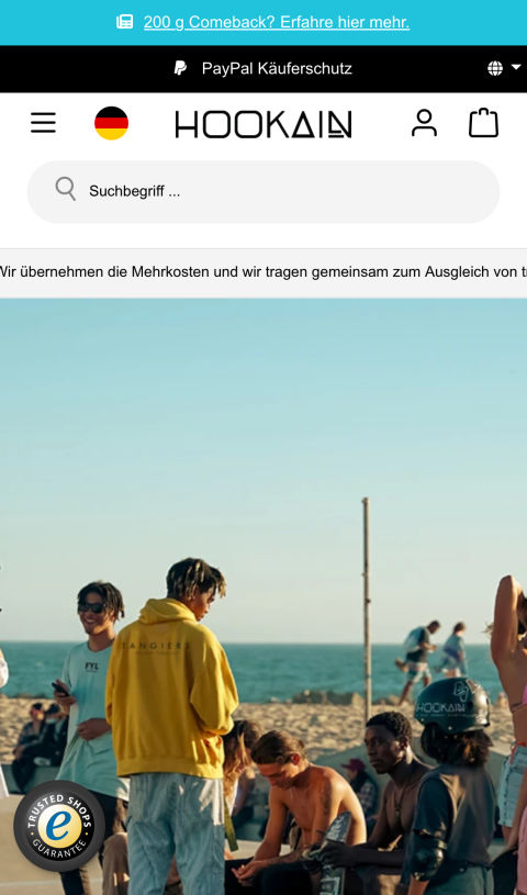 Homepage des Hookain-Onlineshops im mobilen Format mit einem Bild von Menschen, die sich am Strand versammeln