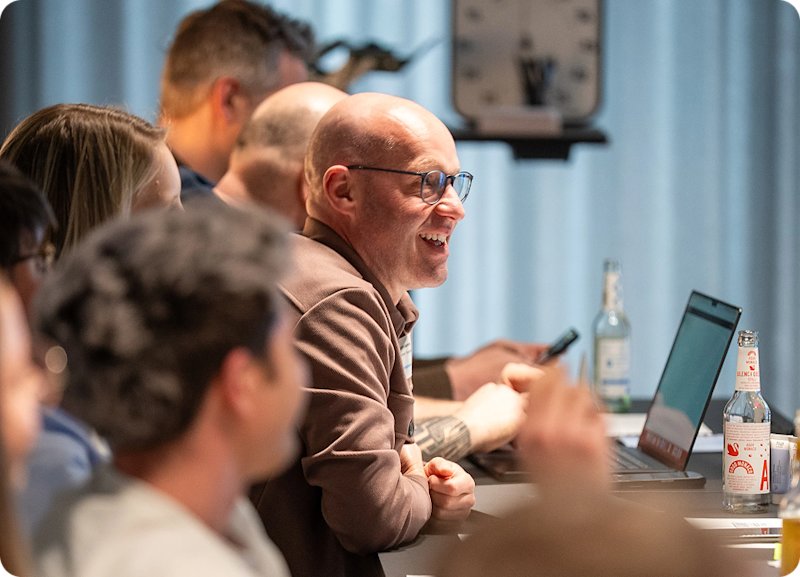 Photo of two colleagues lauging at an event Careers_WorkAtShopware_ImageGallery_Img3