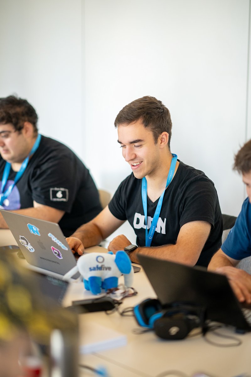 Men coding at Hackathon event