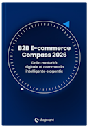 Mockup della copertina del whitepaper “B2B E-commerce Compass 2026” con sfondo blu scuro, grafica circolare a forma di bussola e il sottotitolo “Dalla maturità digitale al commercio intelligente e agentic”.