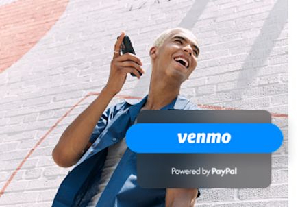 A man laughing while talking on the phone next to a wall, with overlaid text reading “Venmo: Powered by PayPal.”