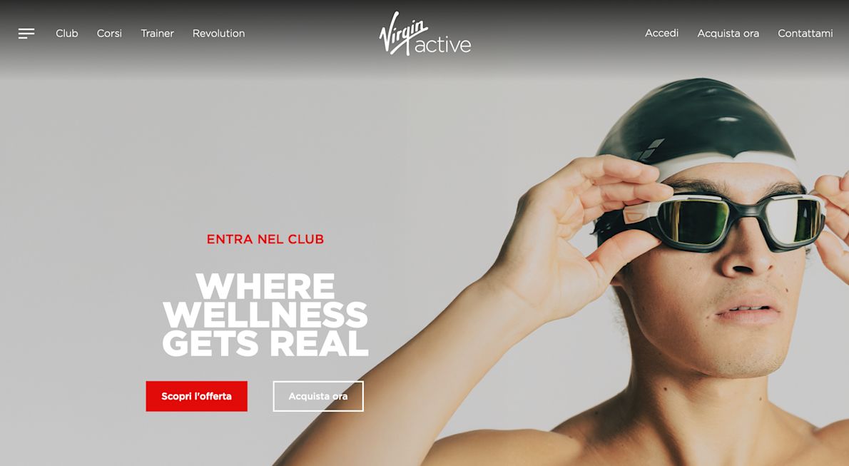 Virgin Active Homepage showing a featured image of a swimmer putting on goggles, menu options and text "Where wellness gets real"