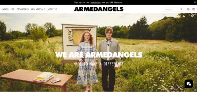 Image of Armendangels homepage showing a woman and a man posing in a field filled with grass.