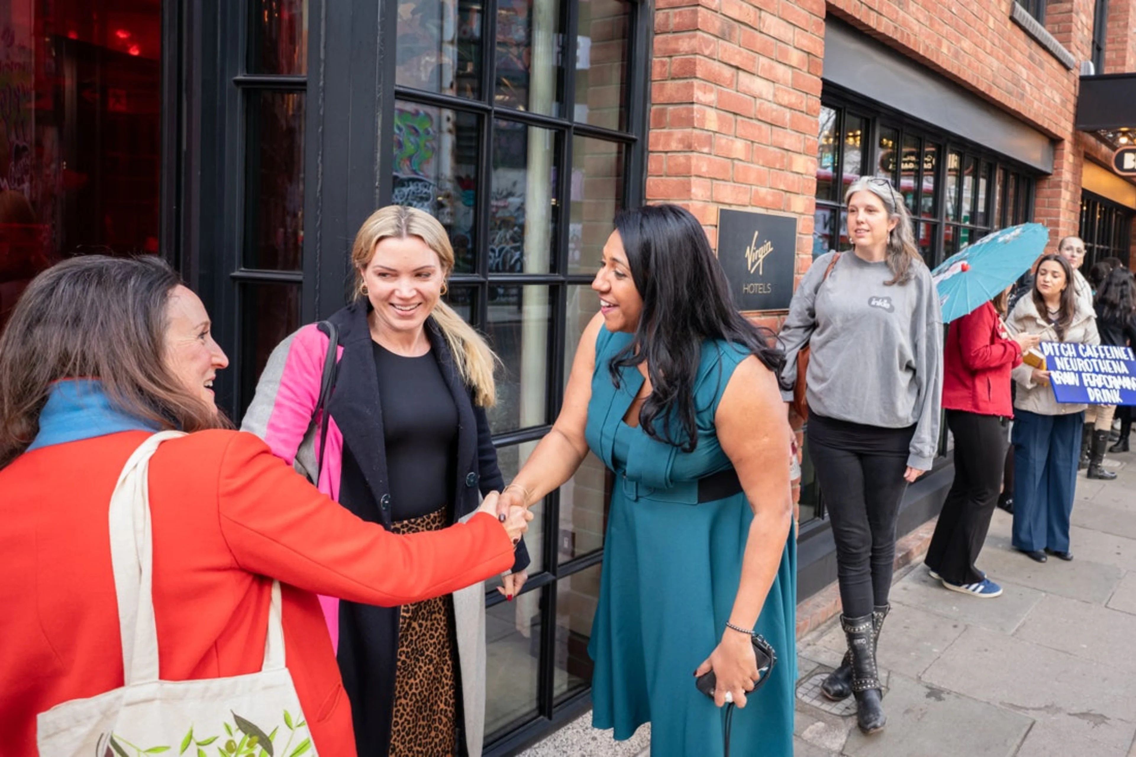 Women founders shaking hands