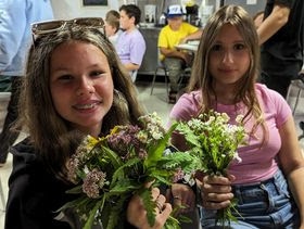 camp 2024 two little girls with flowers