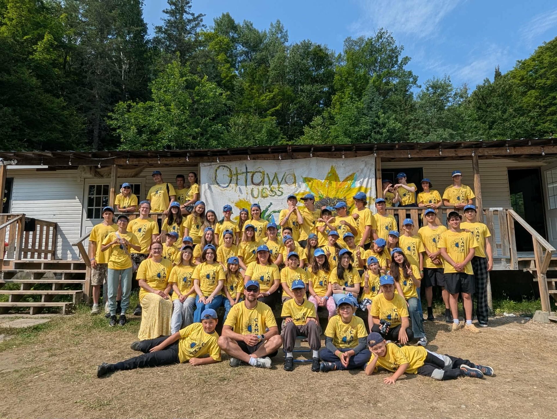 Campers and staff at UCSS Ottawa’s Sunflower Camp gather for a group photo, celebrating friendship, community, outdoor learning, and meaningful summer experiences.